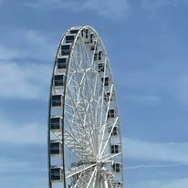 a ferris wheel on the boardwalk