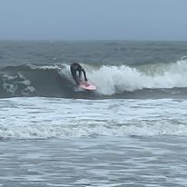 a picture of a surfer on the waves