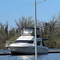 a white yacht sitting in the water